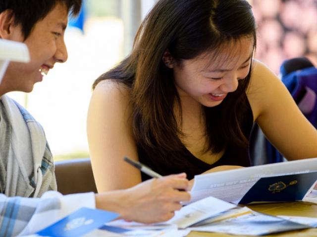 Students studying and laughing